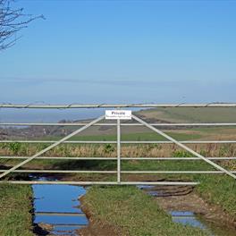 Galvanised gate securing field. 