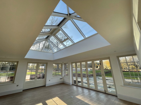 Roof lantern built into brand new extension with all white painted walls, supplied by FORT Builders' Merchant. 