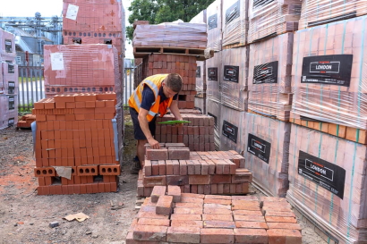 Image of FORT staff member counting stock of Bricks.