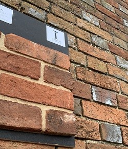 Brick board against original brick wall, brick match service. 
