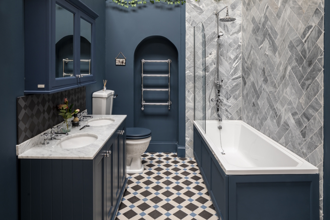 Lifestyle image displaying a traditional ocean blue bathroom design. 